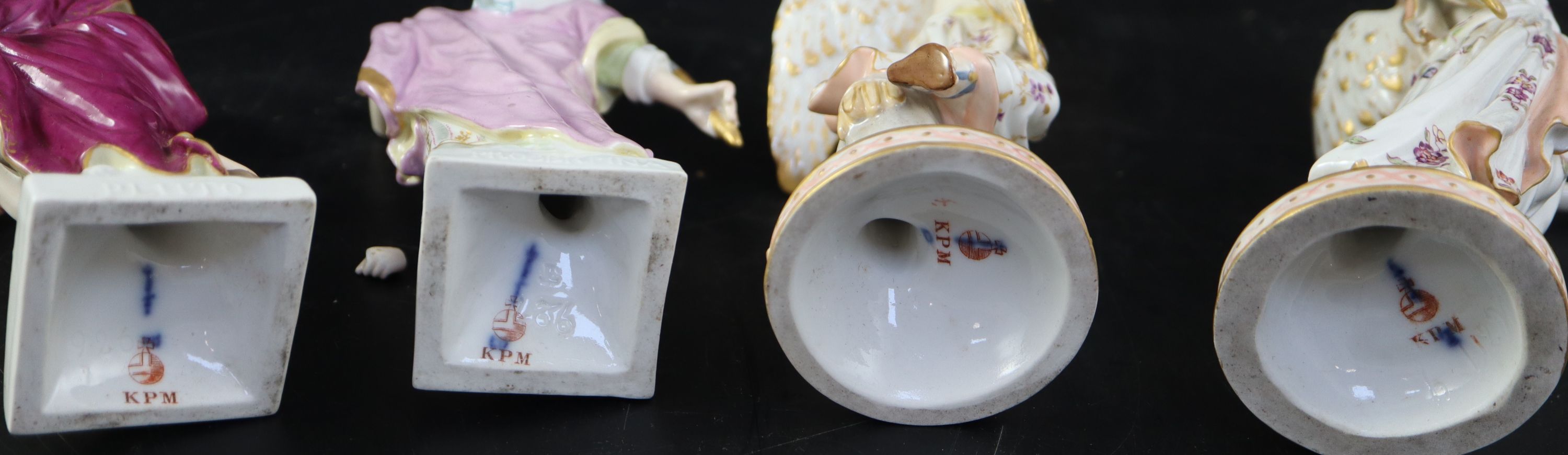 A pair of KPM Berlin porcelain figures of Pluto and Proserpina & pair angels